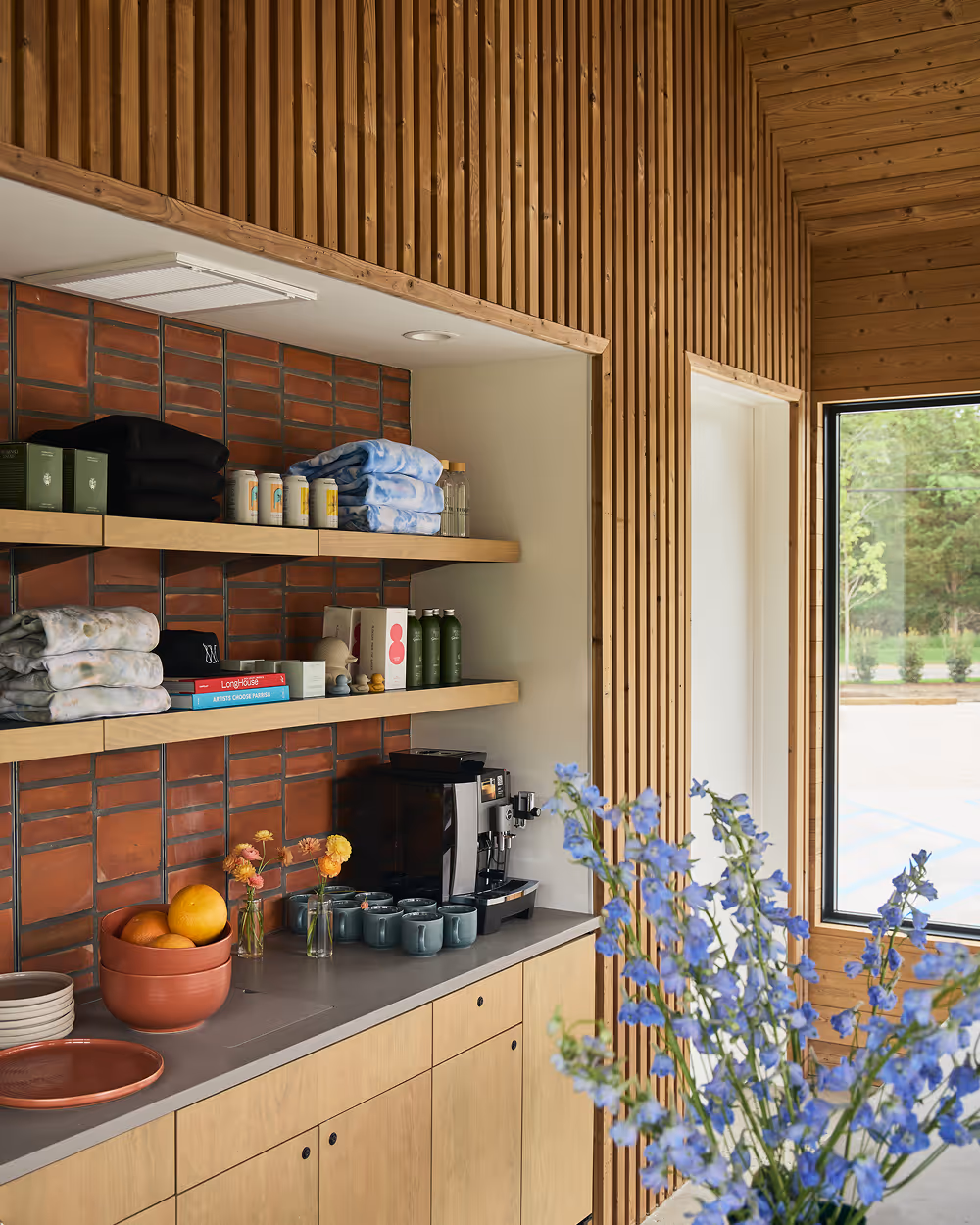 Angle view of counter with shelves displaying produce and products