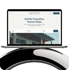 Open laptop displaying a clean real estate website homepage with the headline 'Verified Properties. Trusted Deals.' and a search bar beneath.