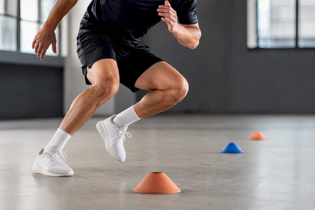 Player planting during football shuttle drill