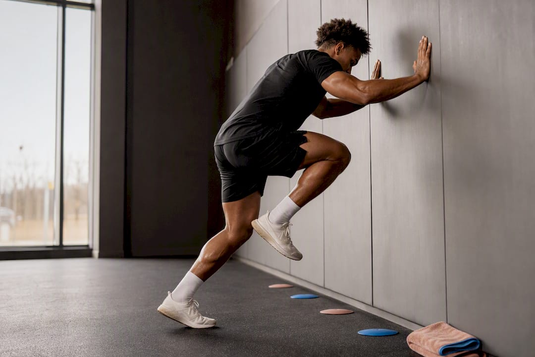 Player performing wall drive warmup drill