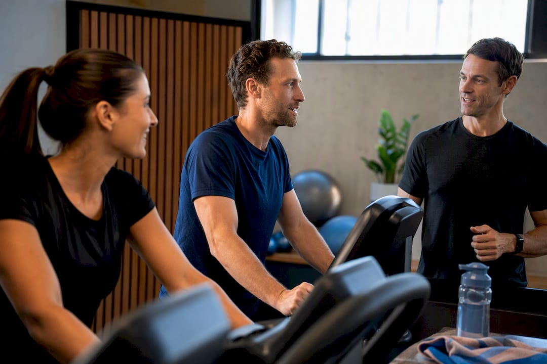 Coach guiding steady small-group aerobic training