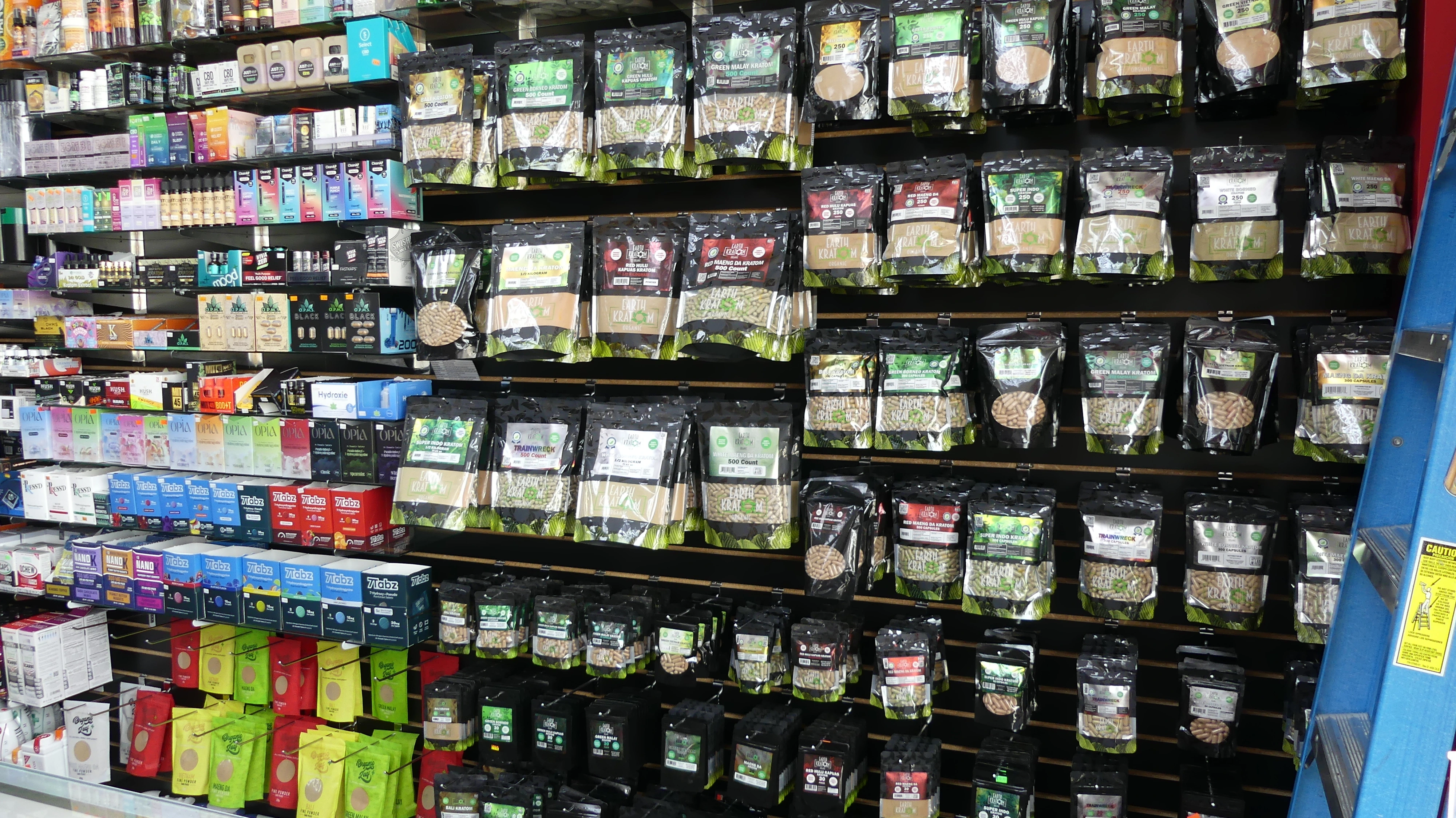 an image inside of the store, showing the selection of kratom powder and capsules