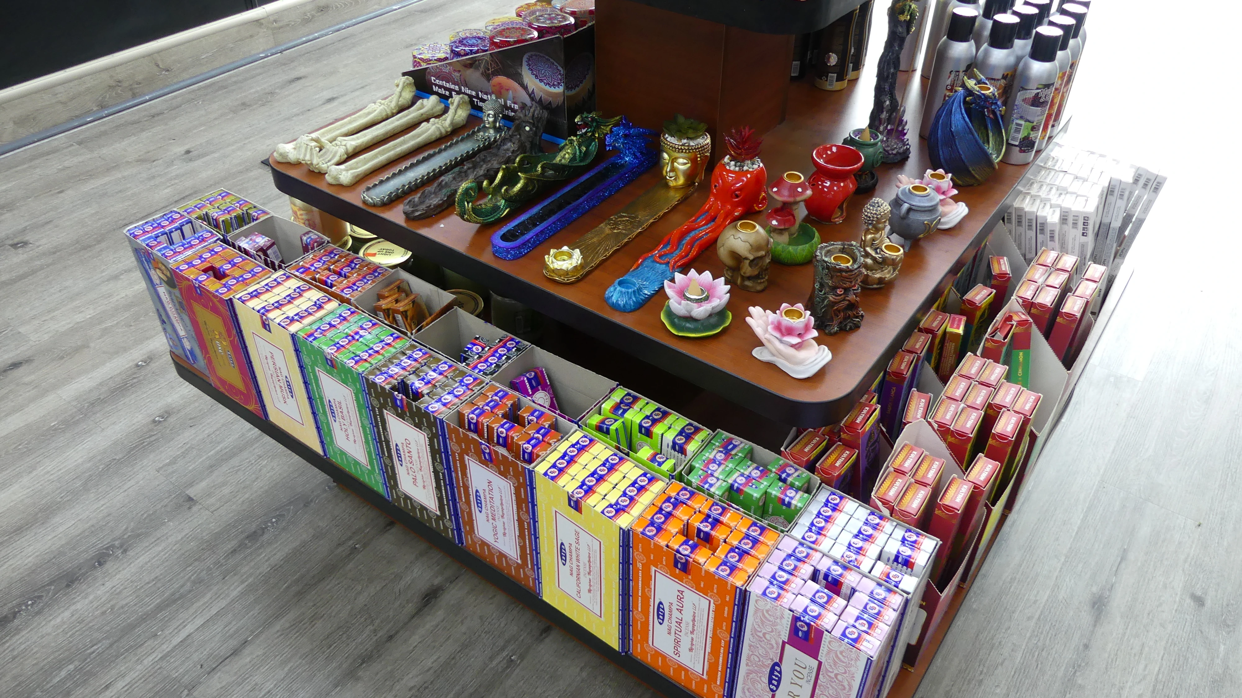 an image inside of the store, showing the selection of candles and incense holders