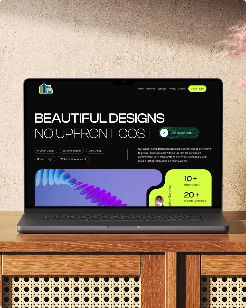 A laptop displaying a website with a dark theme featuring text that highlights beautiful designs with no upfront cost. It includes sections for product design, graphic design, and web design, placed on a wooden table.