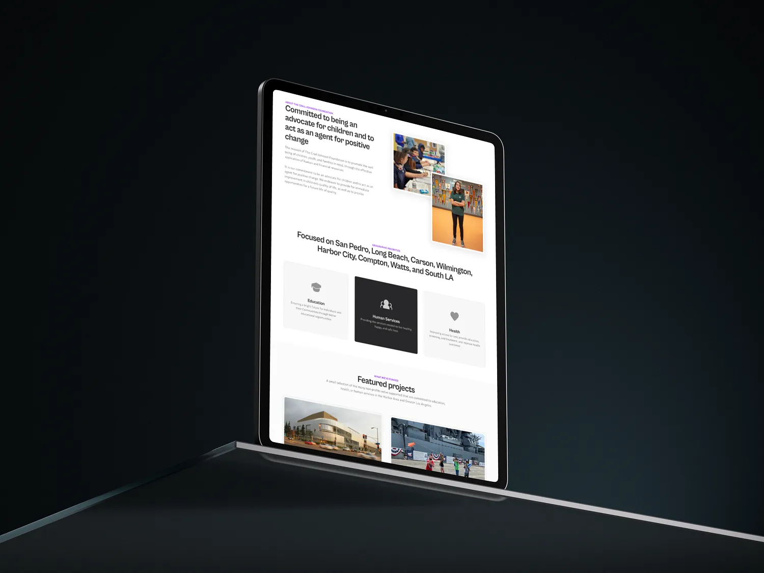 An ipad showing a website for an NGO company.