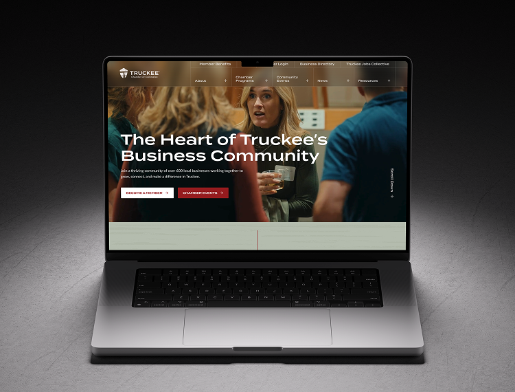 A workspace featuring a dual-monitor setup for coding and design, with an iPad, phone, coffee, and a plant.