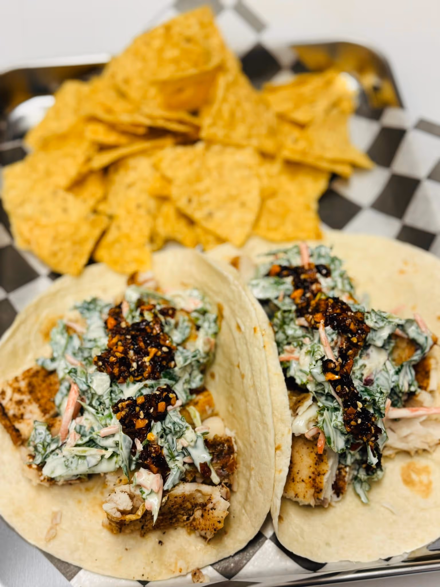 2 tacos with chips on the side