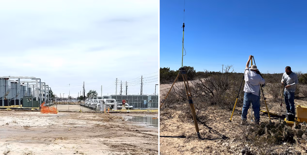 Two men in a dry, shrub-filled landscape setting up surveying equipment near a tall tripod with an antenna.