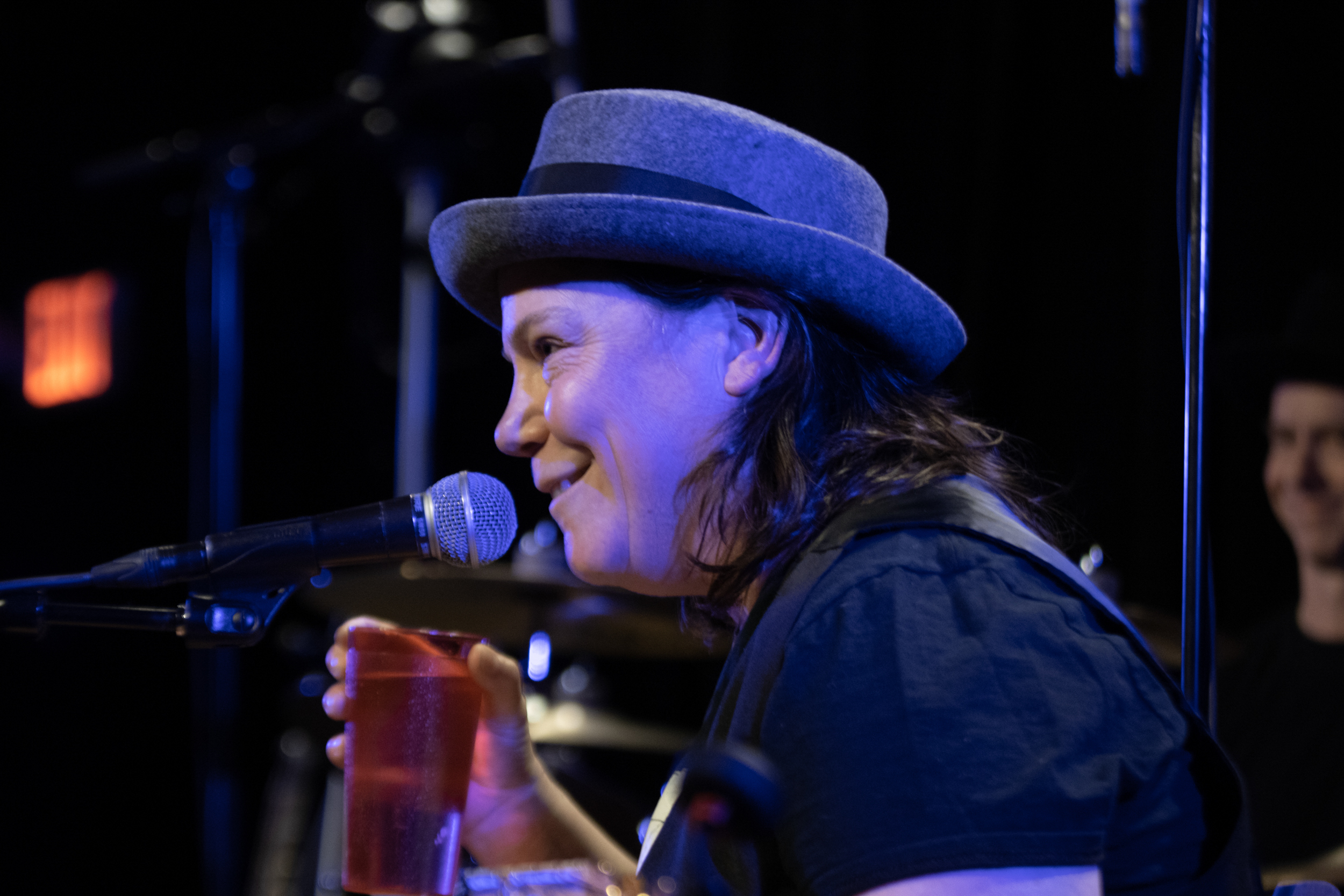 Close up image of Annie smiling during concert