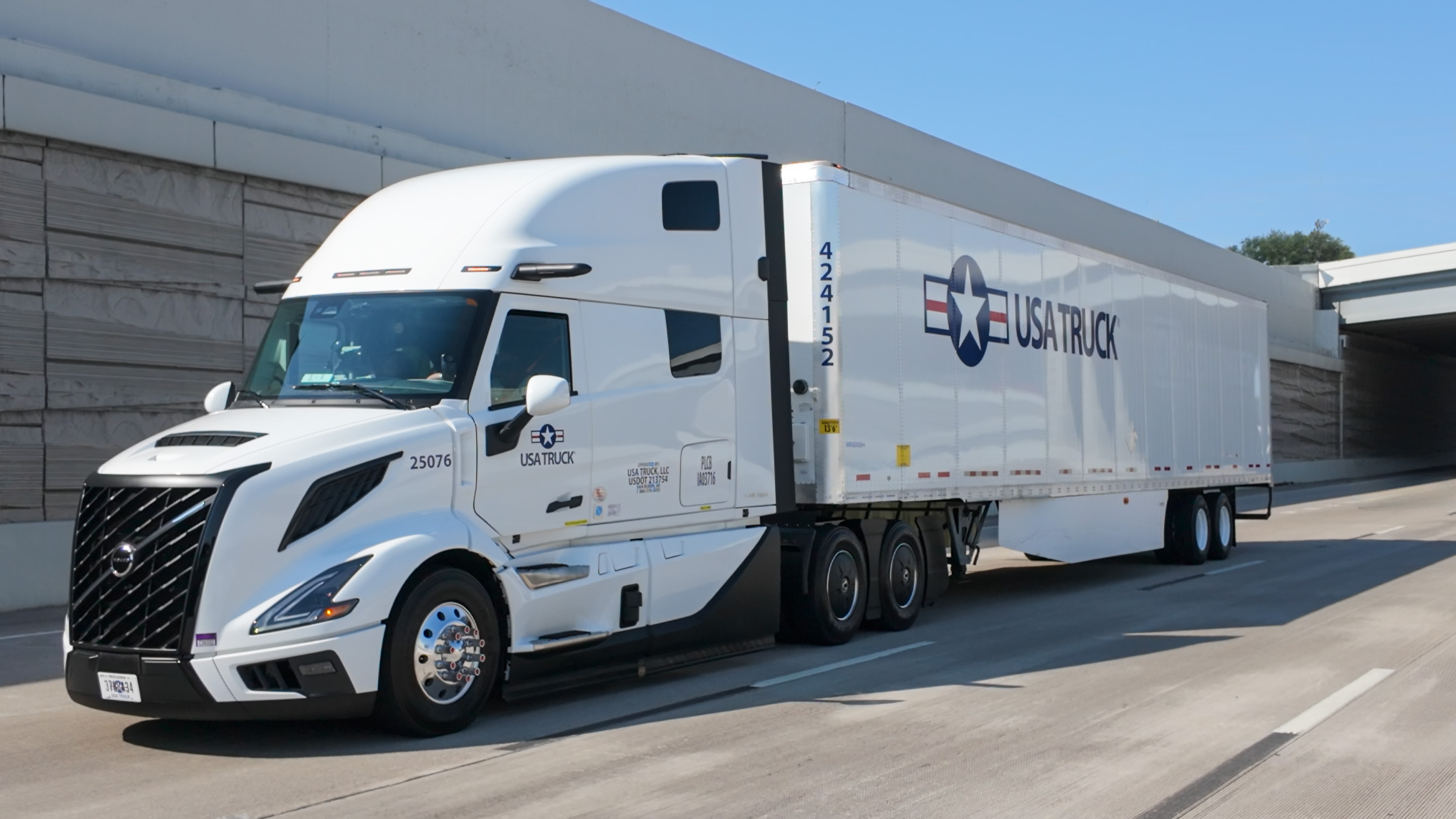 semi truck driving down the road