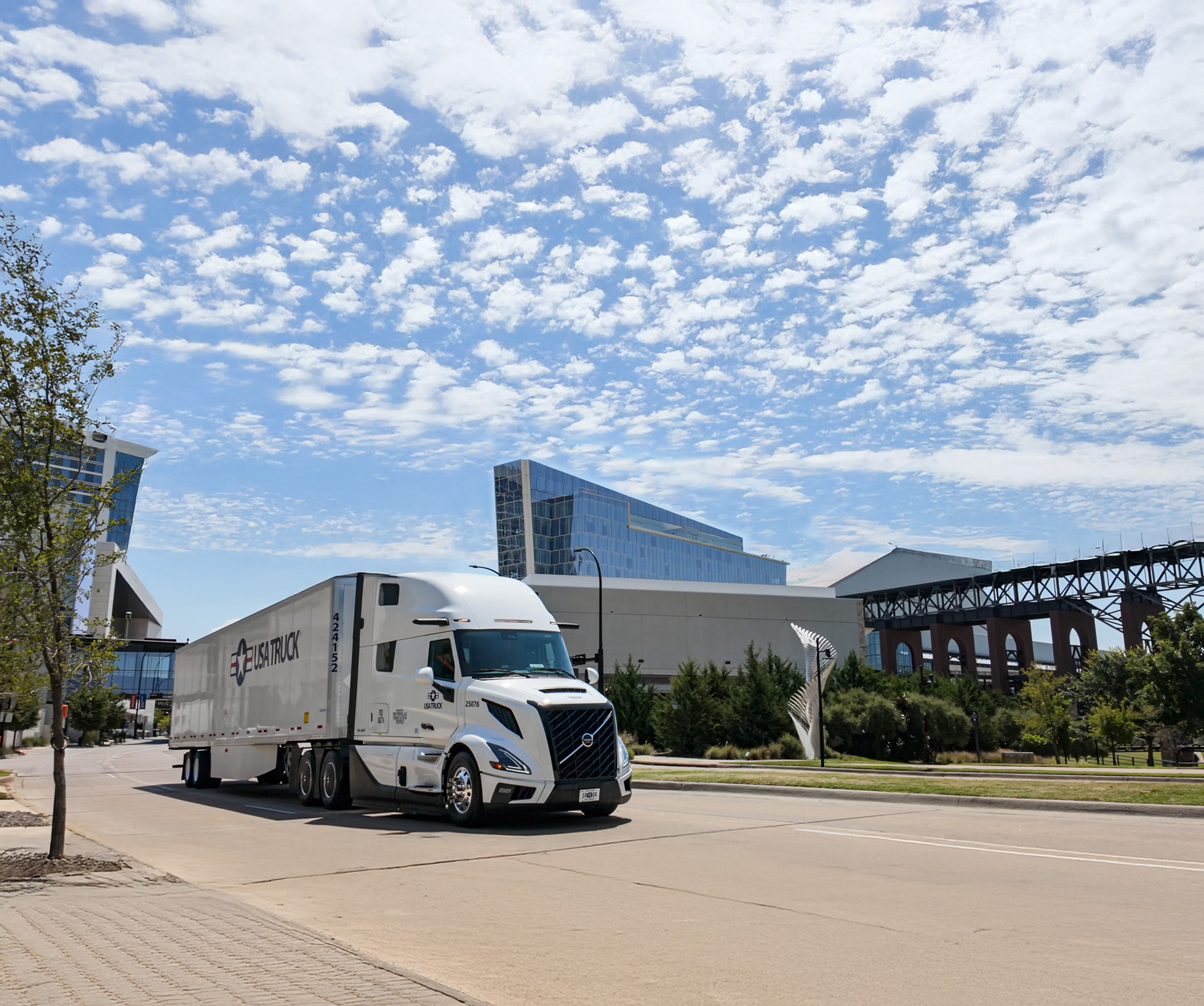semi truck driving down the street