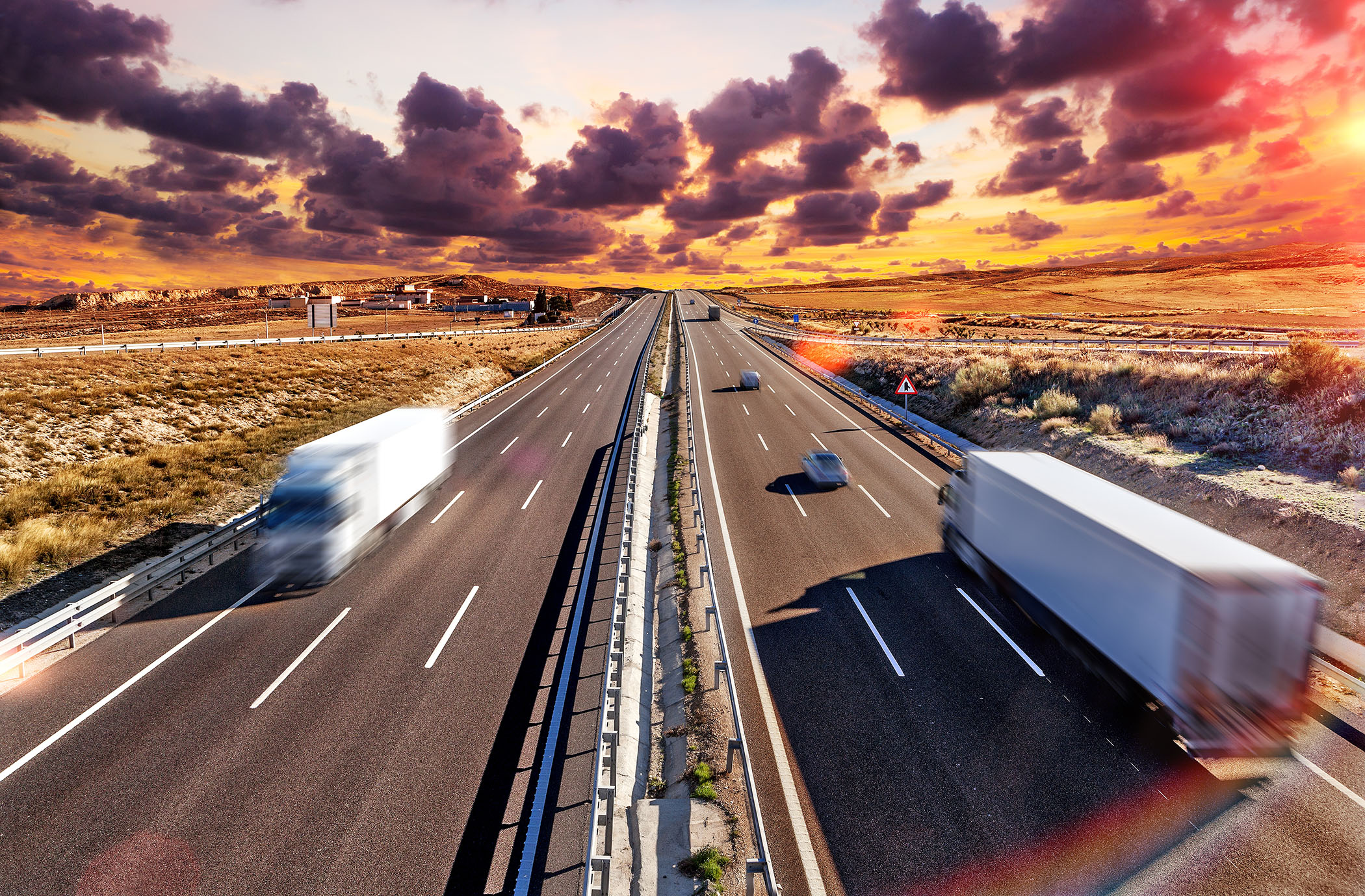 semi trucks passing each other on highway