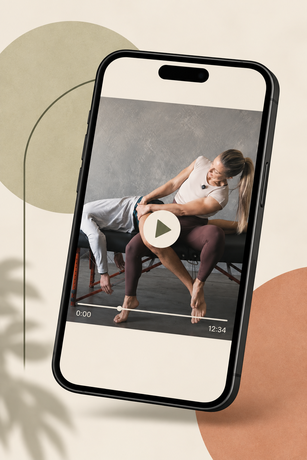 Smartphone displaying fitness video of woman performing stretching