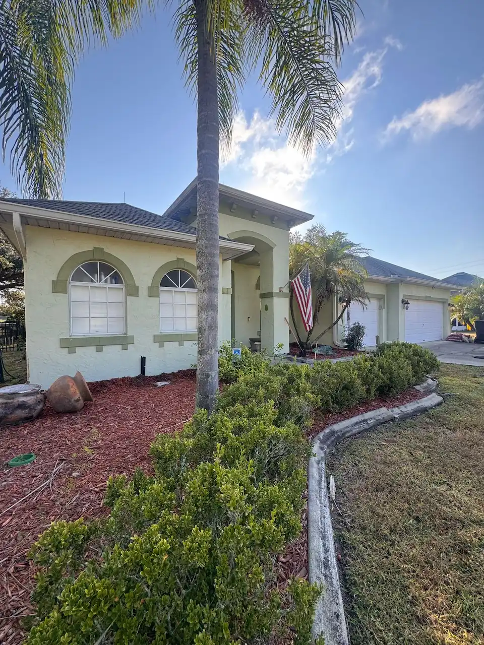 Living room before interior painting, showing older wall paint and dated look