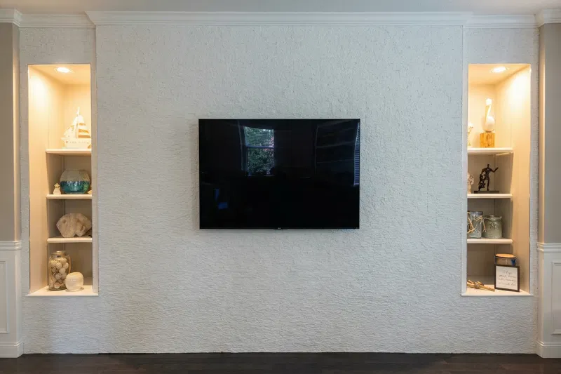 Living room before interior painting, showing older wall paint and dated look