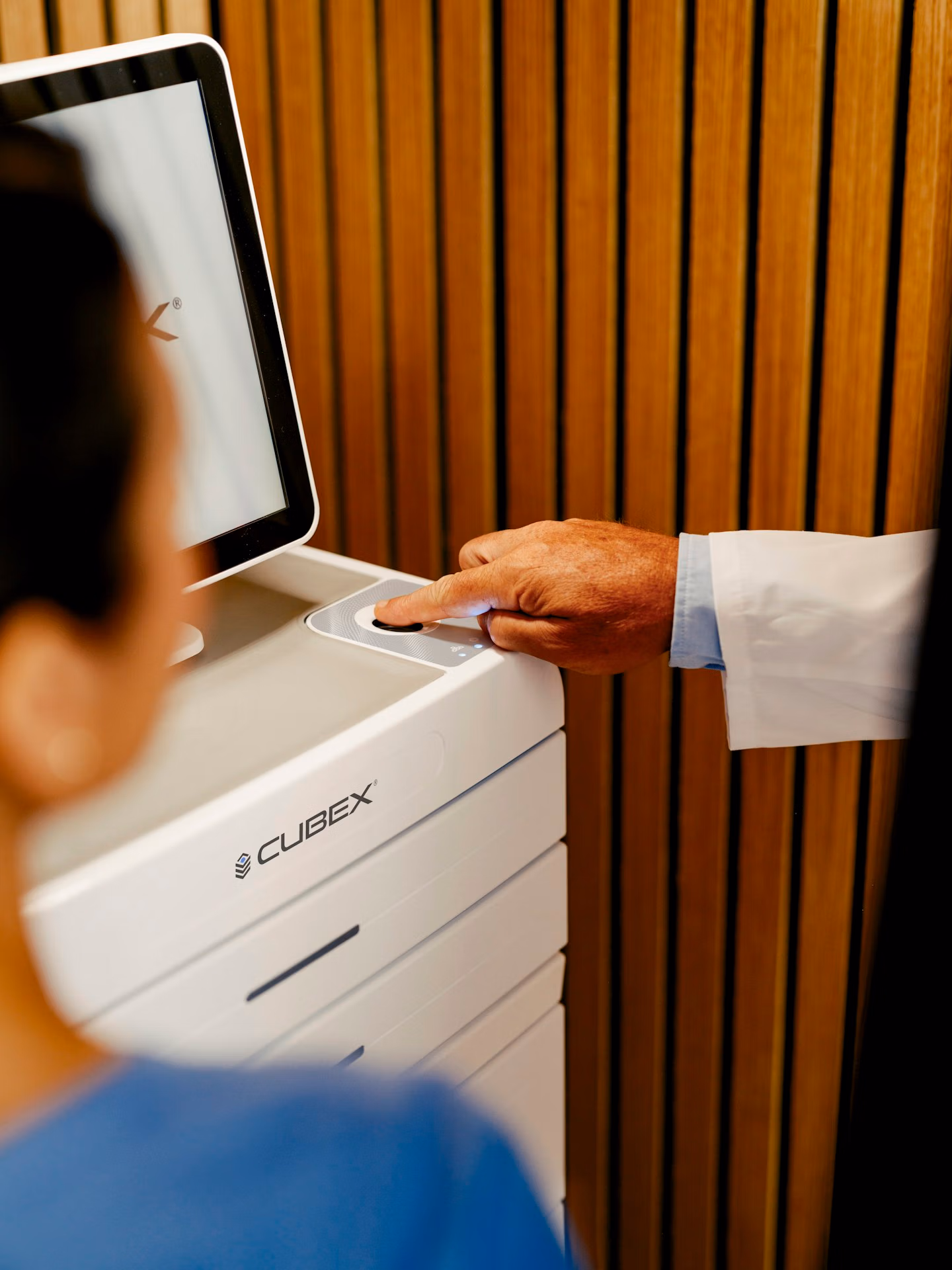 Doctor using fingerprint on a Cubex tower cabinet