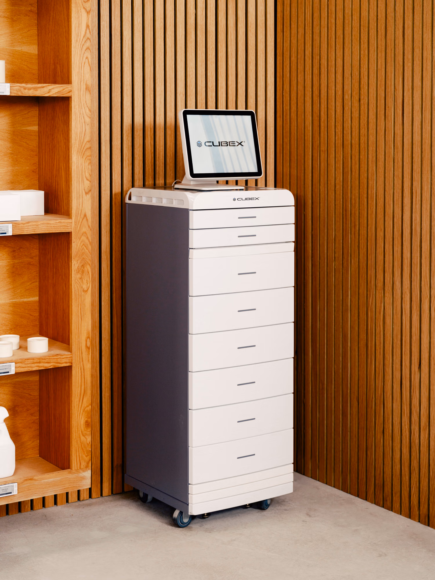 Photo of a Cubex tower cabinet in a room next to a shelf