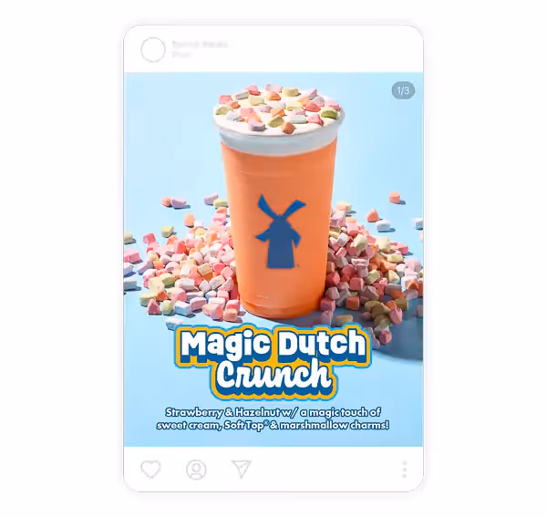 Strawberry and hazelnut blended drink topped with whipped sweet cream and colorful marshmallow cereal, styled on pastel blue—perfect for dessert drink, iced beverage, and colorful drink photography.