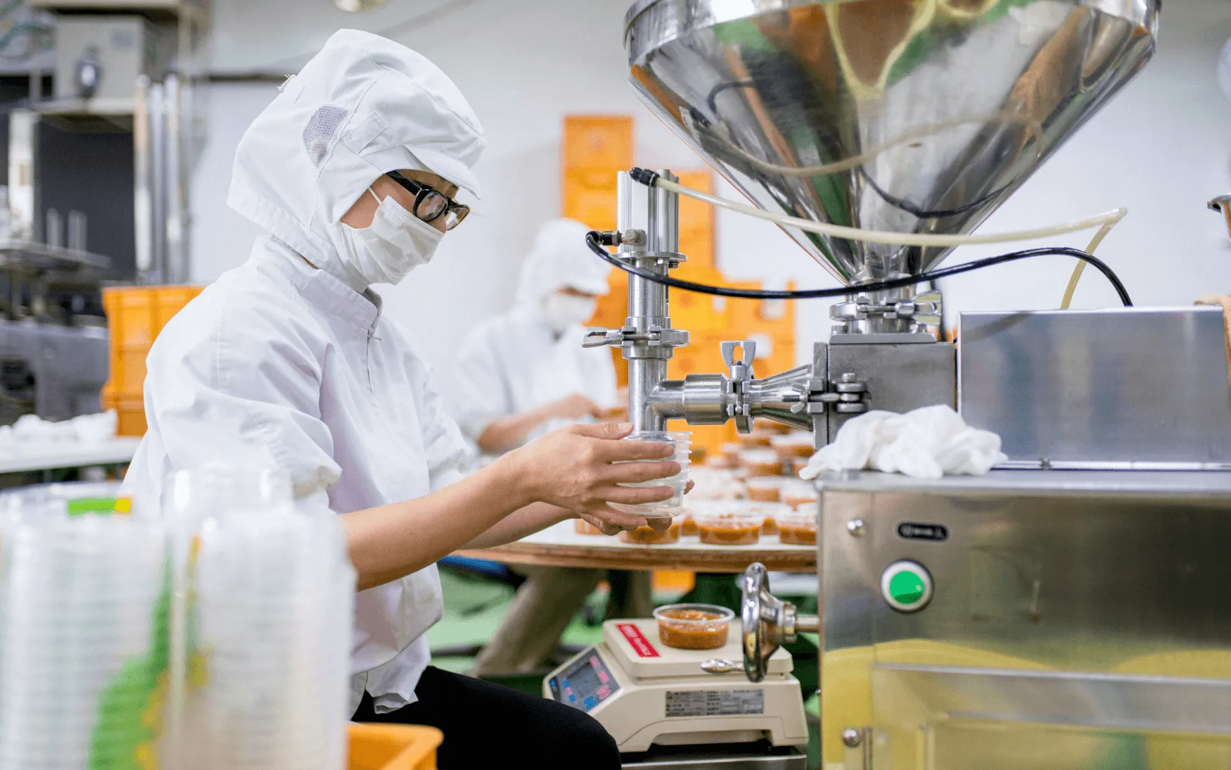 Workers in cleanroom on food and beverage line