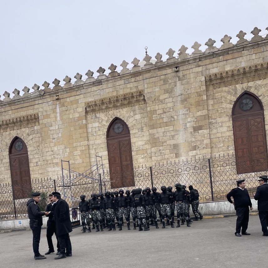 A photograph of security forces standing outside al-Azhar Mosque.