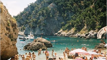 A beautiful beach spot with people bathing