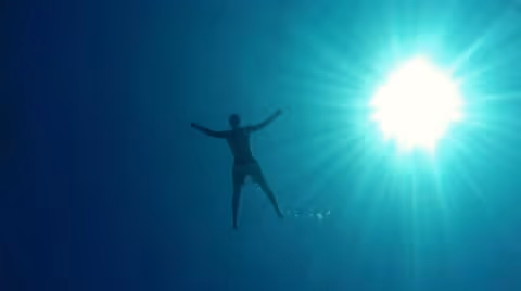 Man floating on water, bottom of the sea... | Stock Video | Pond5