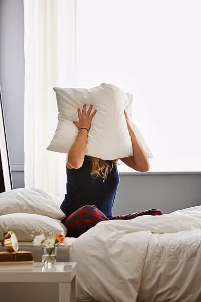 Woman Sitting In Bed With Pillow Over Face Stock Photo - Download Image Now - Adult, Adults Only, Bed - Furniture - iStock