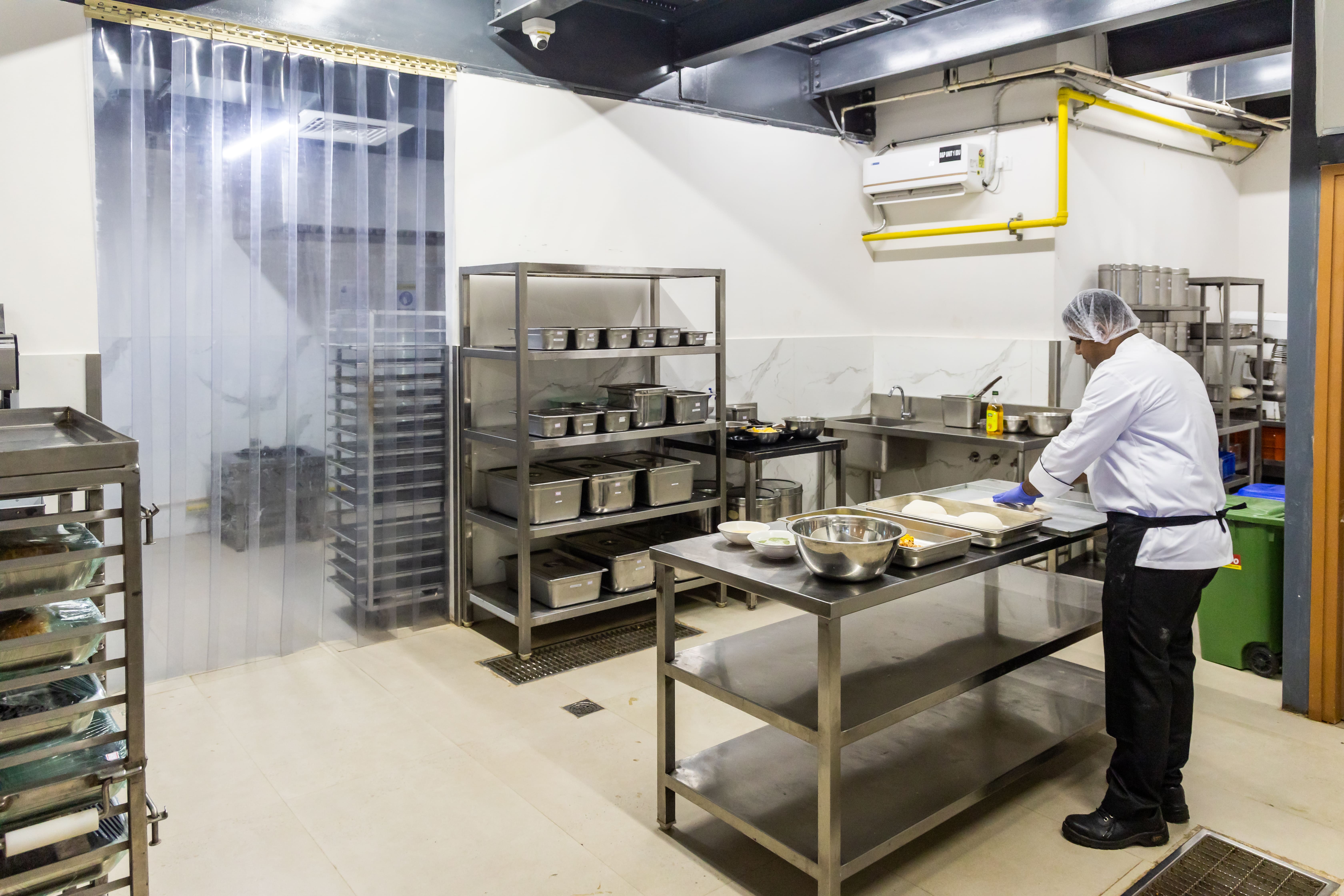 Steel tableware storage area at Nibble Foods central kitchen