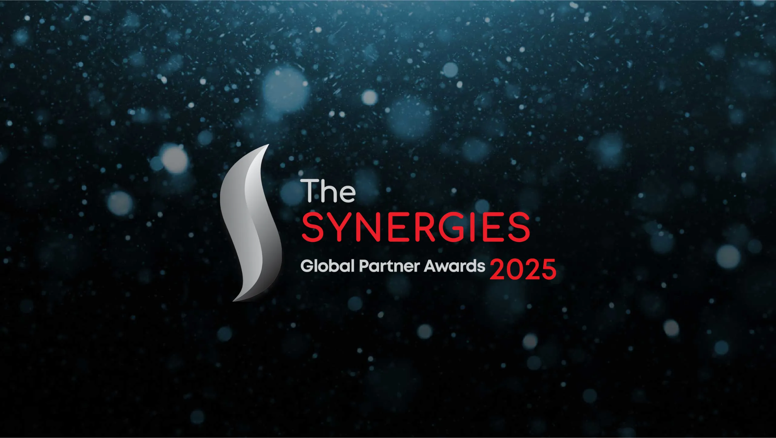 The Synergies Global Partner Awards 2025 logo features a sleek silver emblem on a dark, sparkling background.