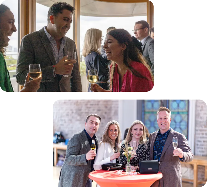 People dressed in formal attire socialize, holding drinks at an indoor and outdoor gathering.