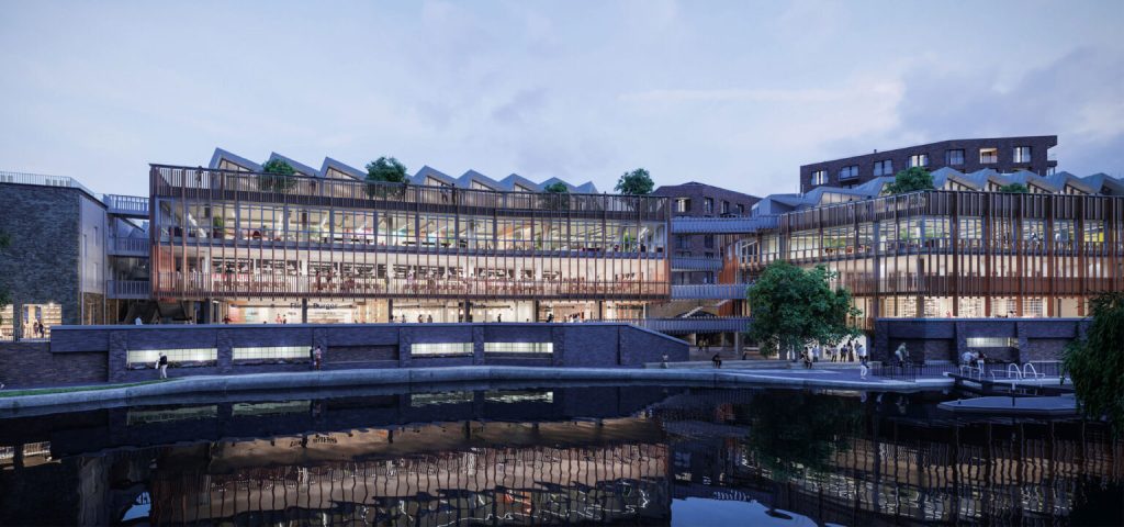 A modern waterfront building with glass facades, wooden accents, and rooftop greenery at dusk.