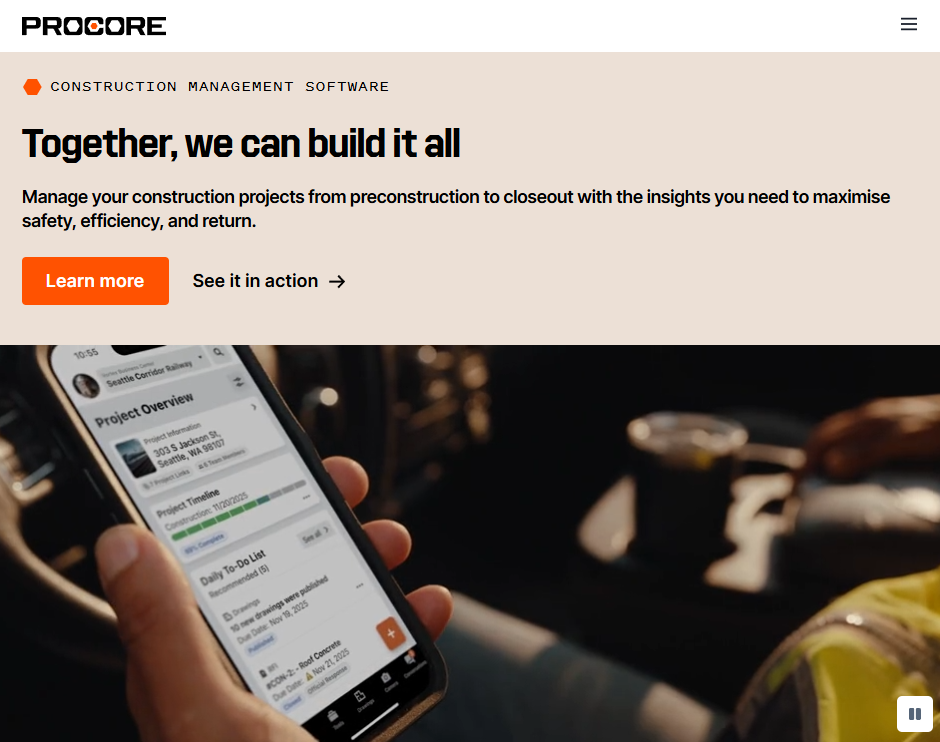Procore website hero section with the headline “Together, we can build it all,” text describing construction management from preconstruction to closeout, buttons for “See pricing” and “See it in action,” and a background image of a phone displaying a project overview on a jobsite. Show less