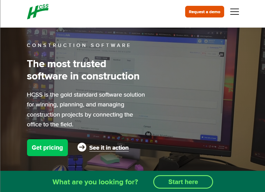 HCSS homepage promoting construction management software, with pricing and product demo buttons over a software dashboard image.