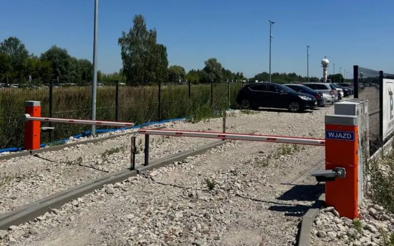 A parking lot with cars parked next to it.