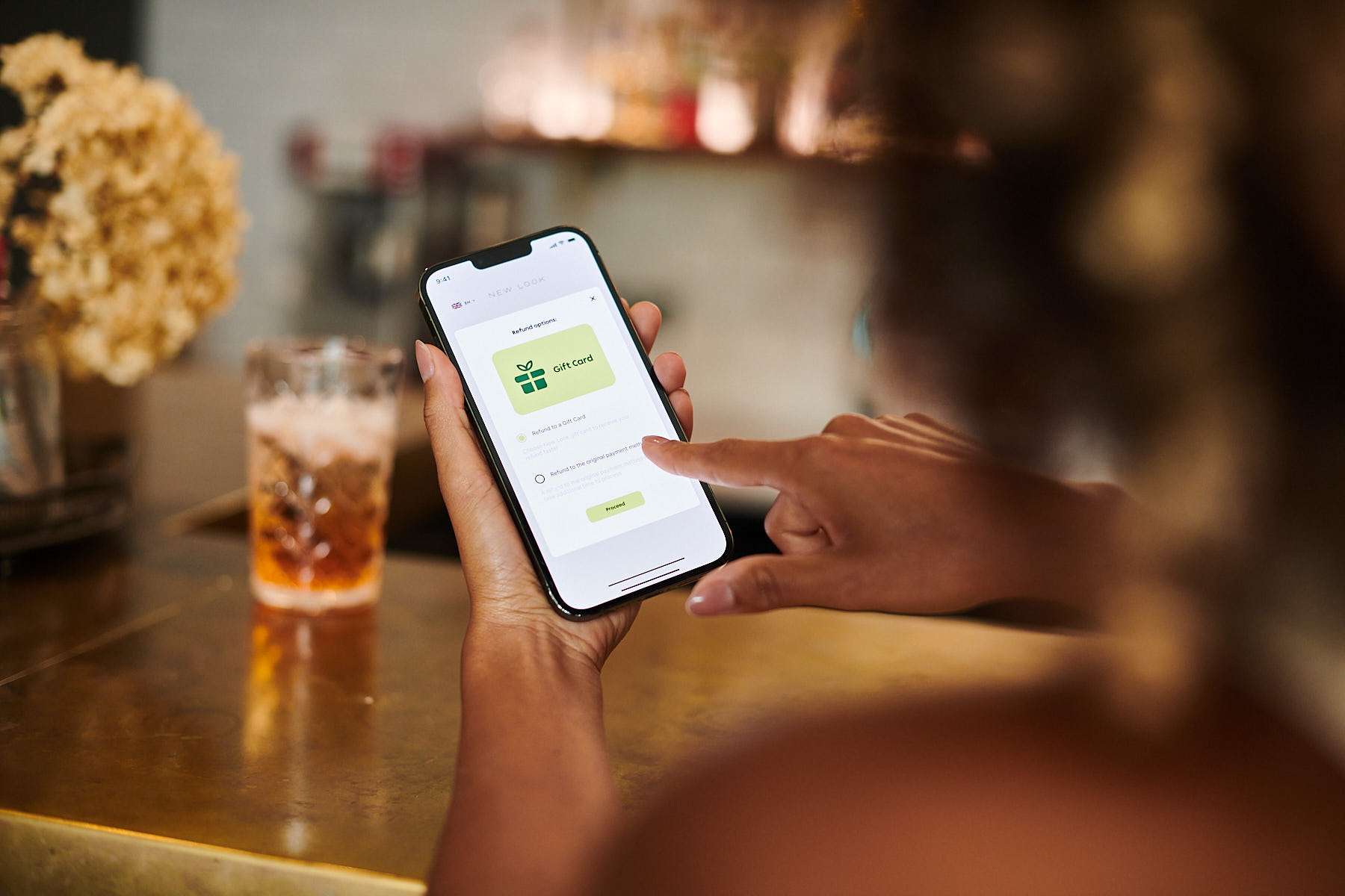 A shopper receiving their refund through a retailer's digital gift card