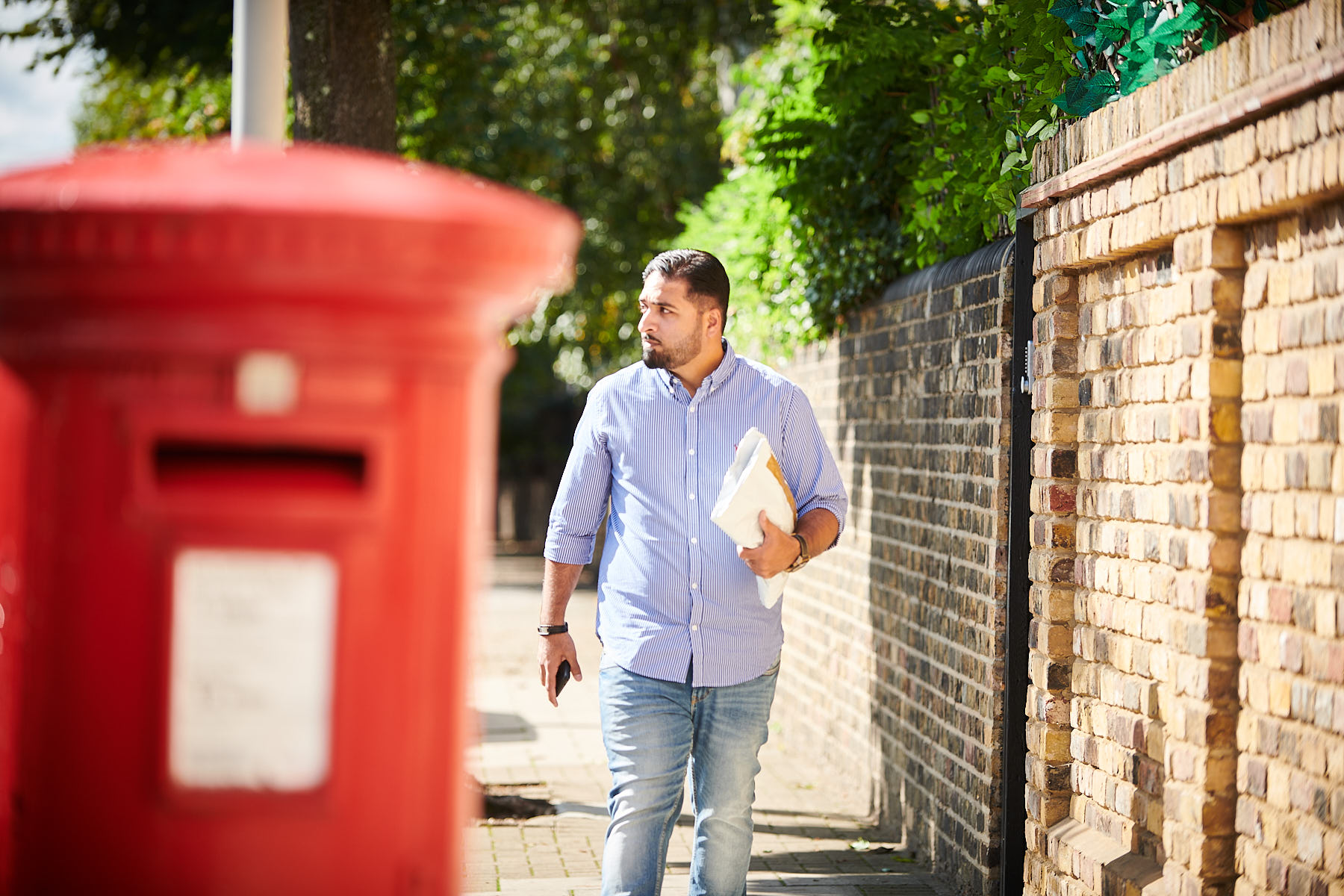 A returner using a post box to send back their return
