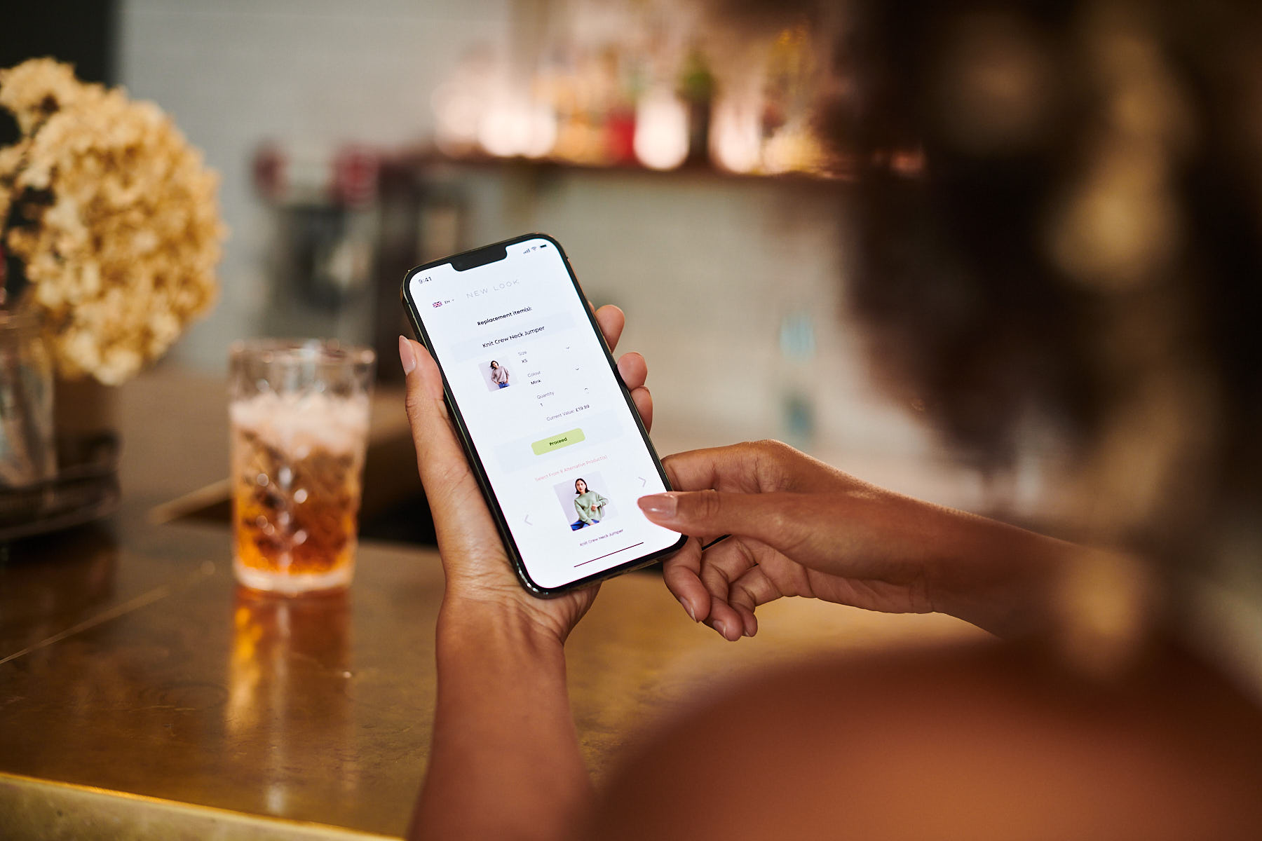 A shopper making a fast fashion return at a bar