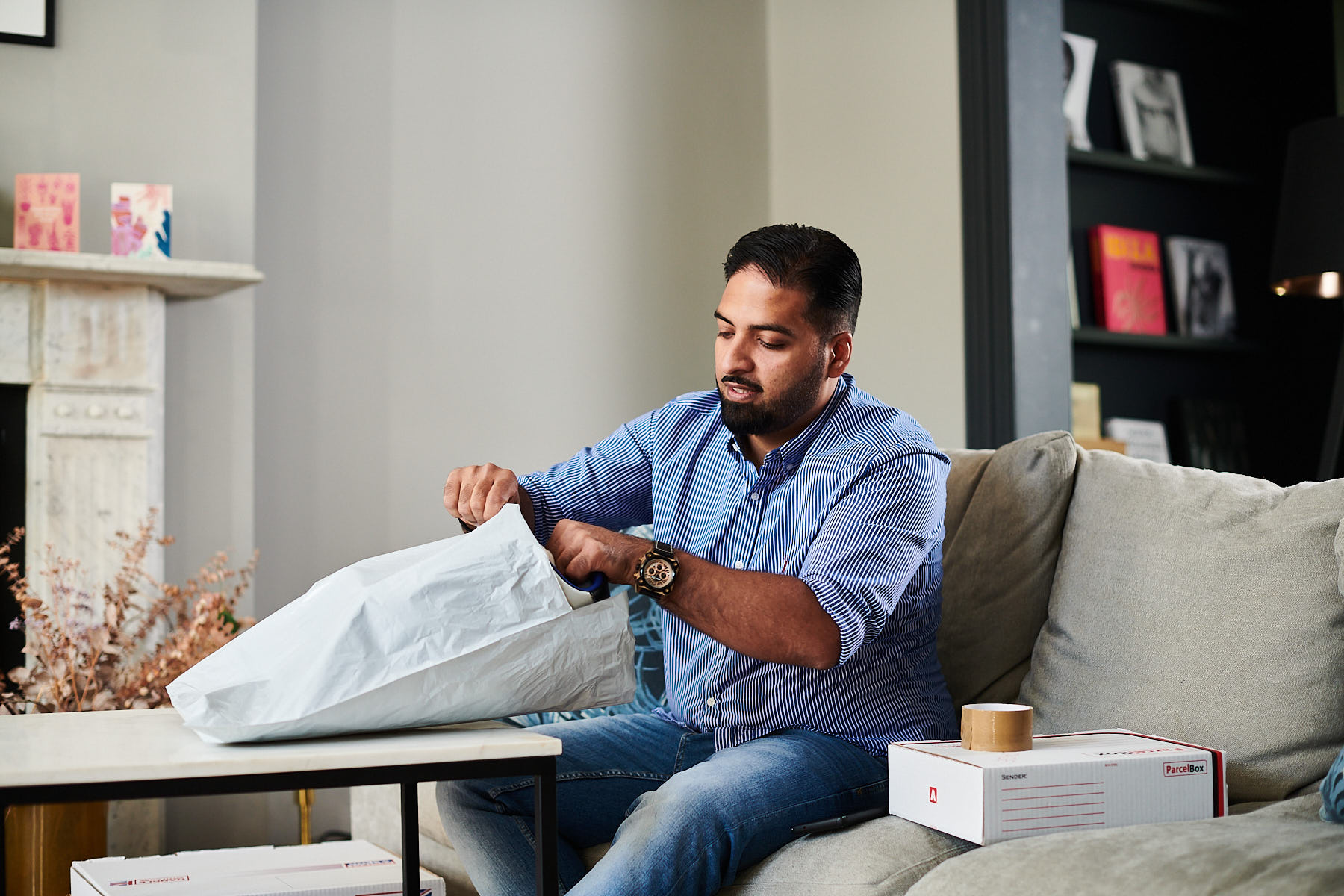 A shopper packaging up returns