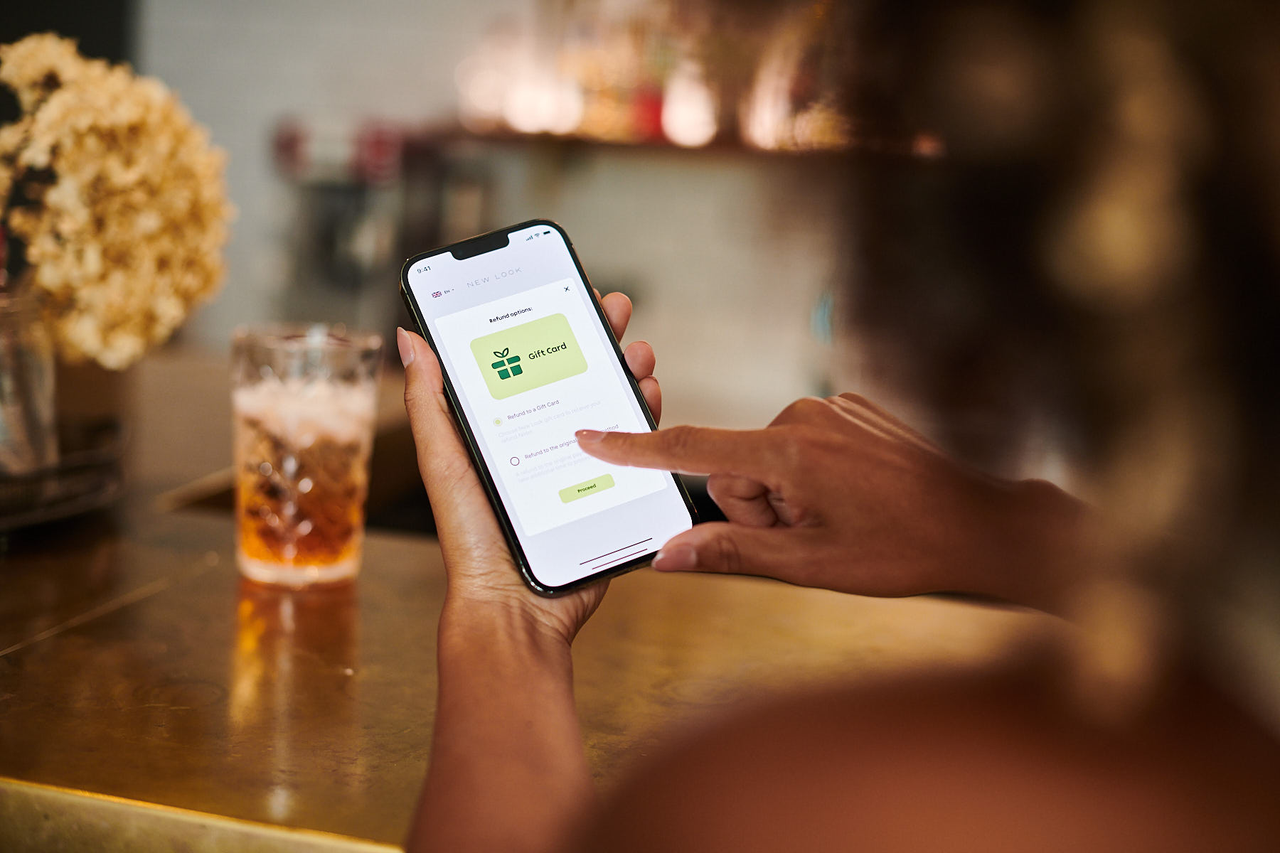 A customer getting their return refund to a retailer's gift card