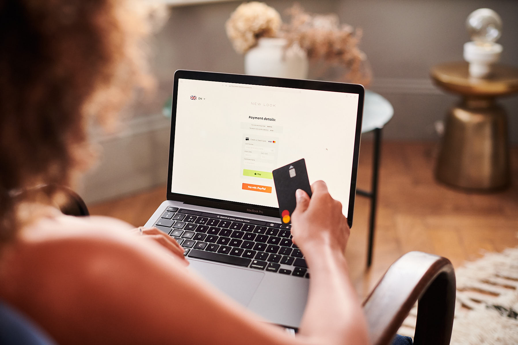A customer paying for an online return