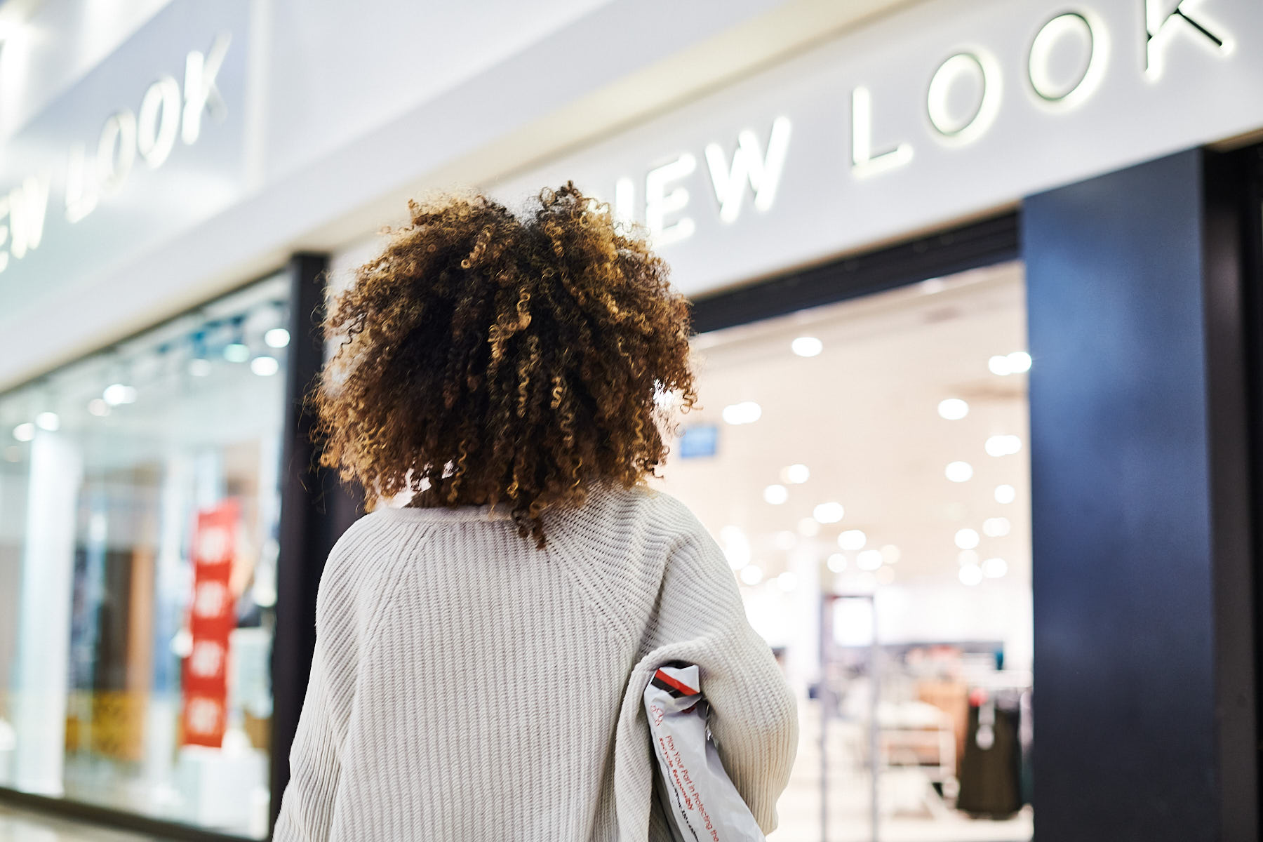 A shopper returning a product in store