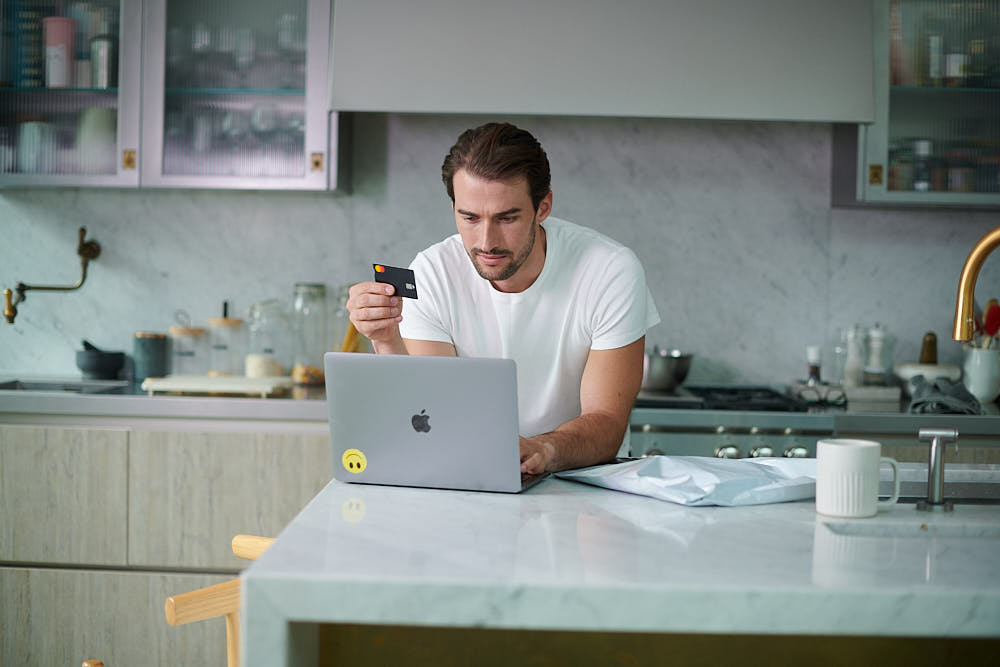 A customer paying for their return