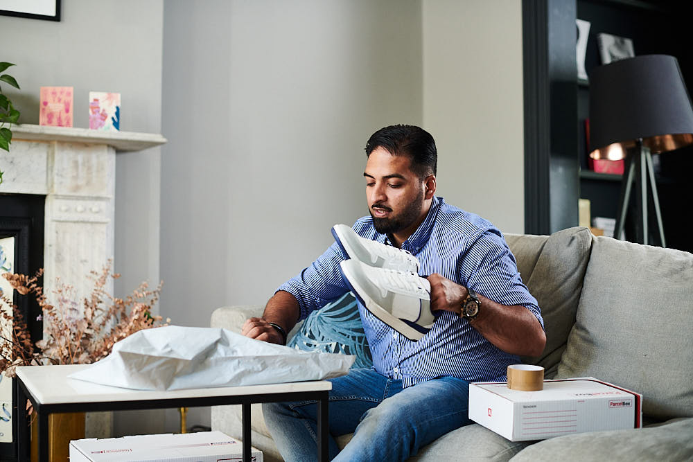 A customer returning shoes