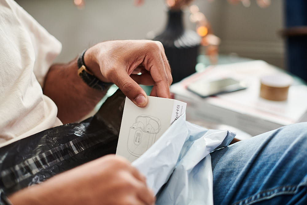 A customer returning electronic headphones