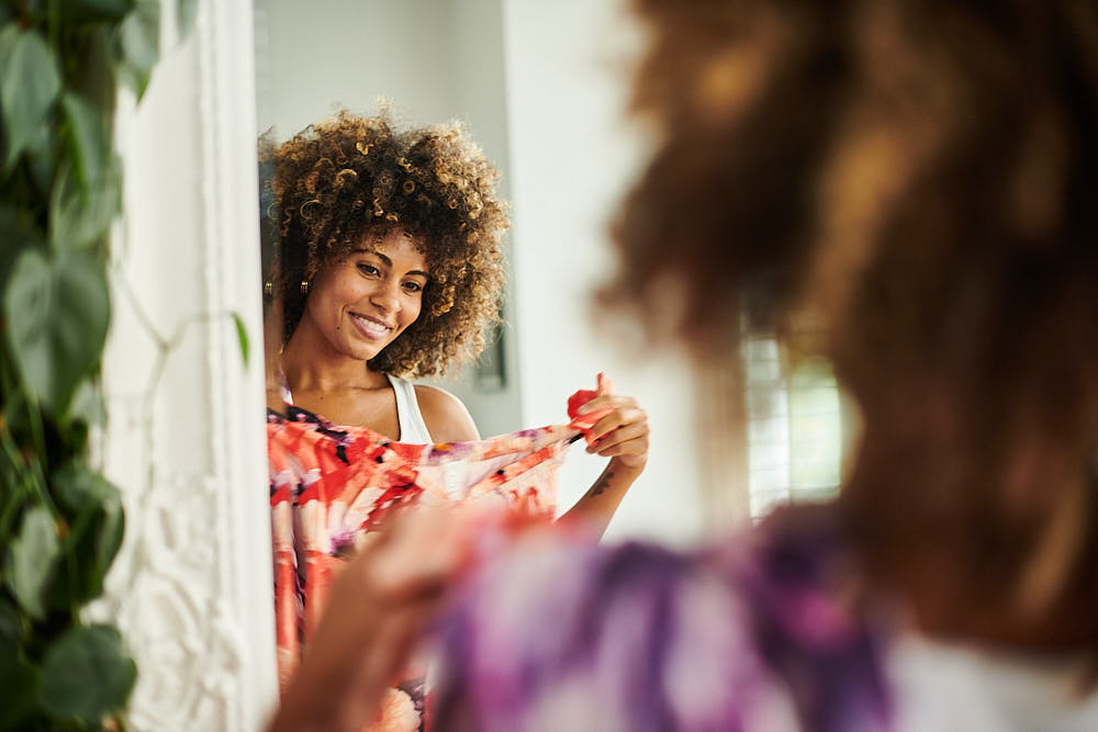 A shopper trying on clothes