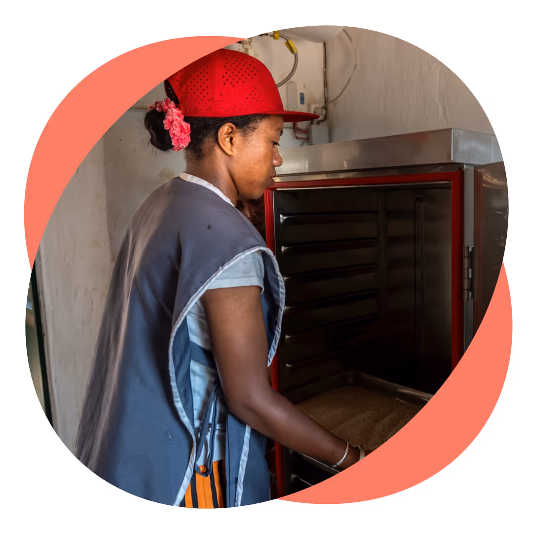 A woman preparing a meal in a school kitchen. 