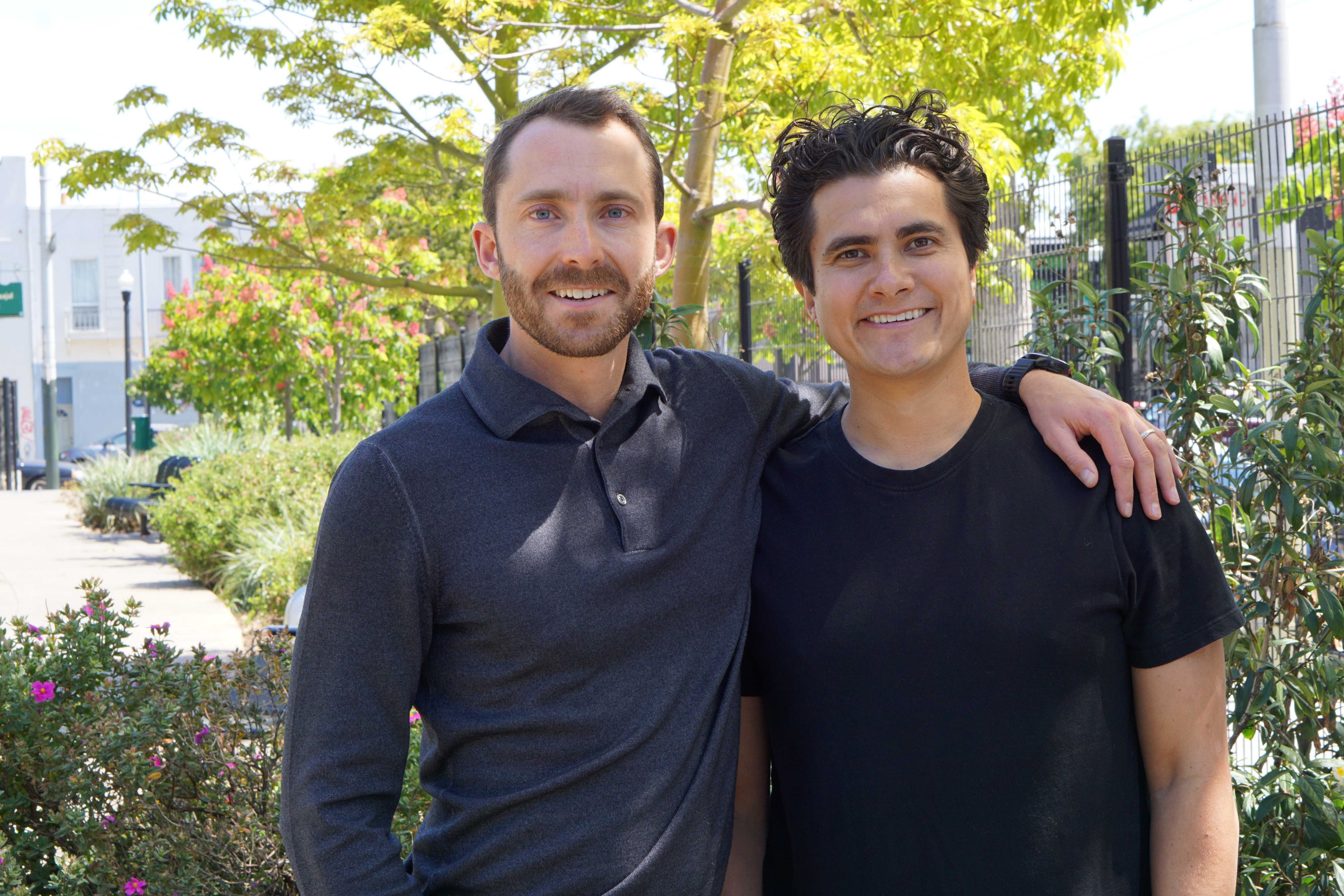 Photo of Crusoe's co-founders, Cully Cavness and Chase Lochmiller, standing together outdoors.