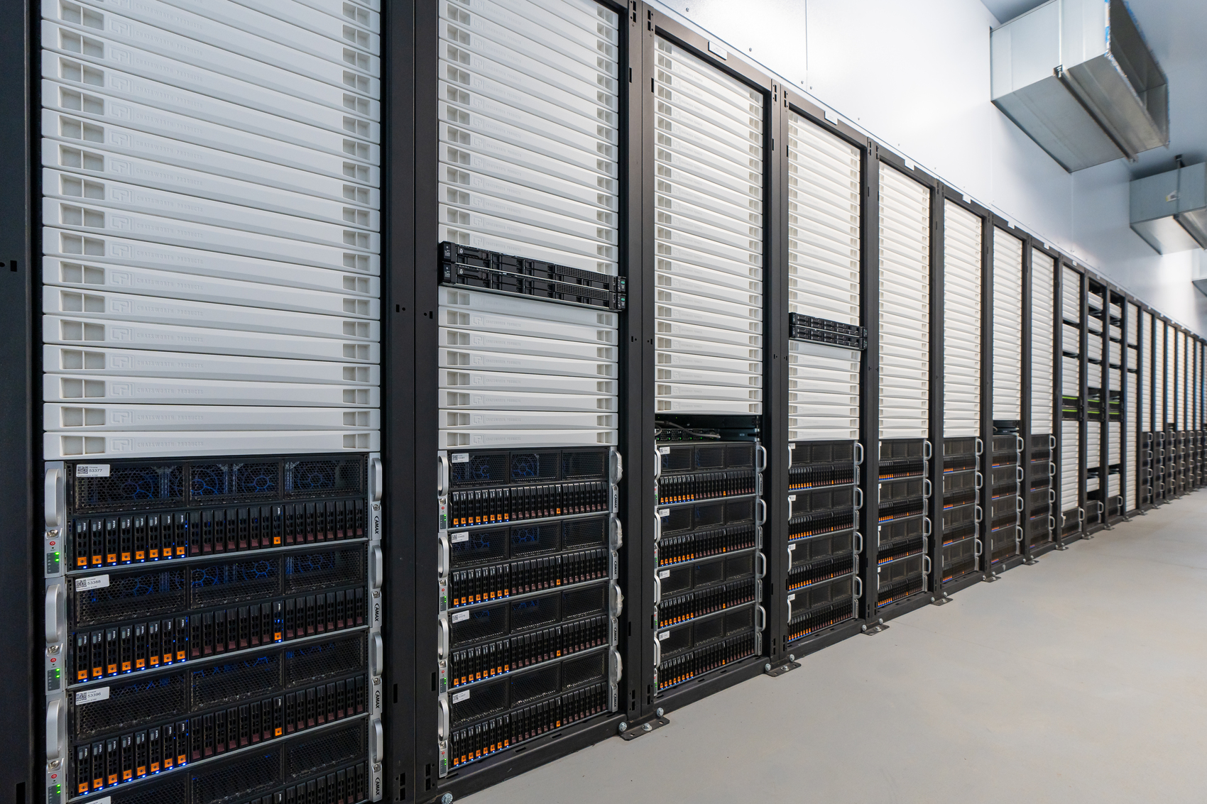 Photo of Crusoe's energy-efficient data center showing rows of GPU servers, designed for cloud computing and AI workloads.