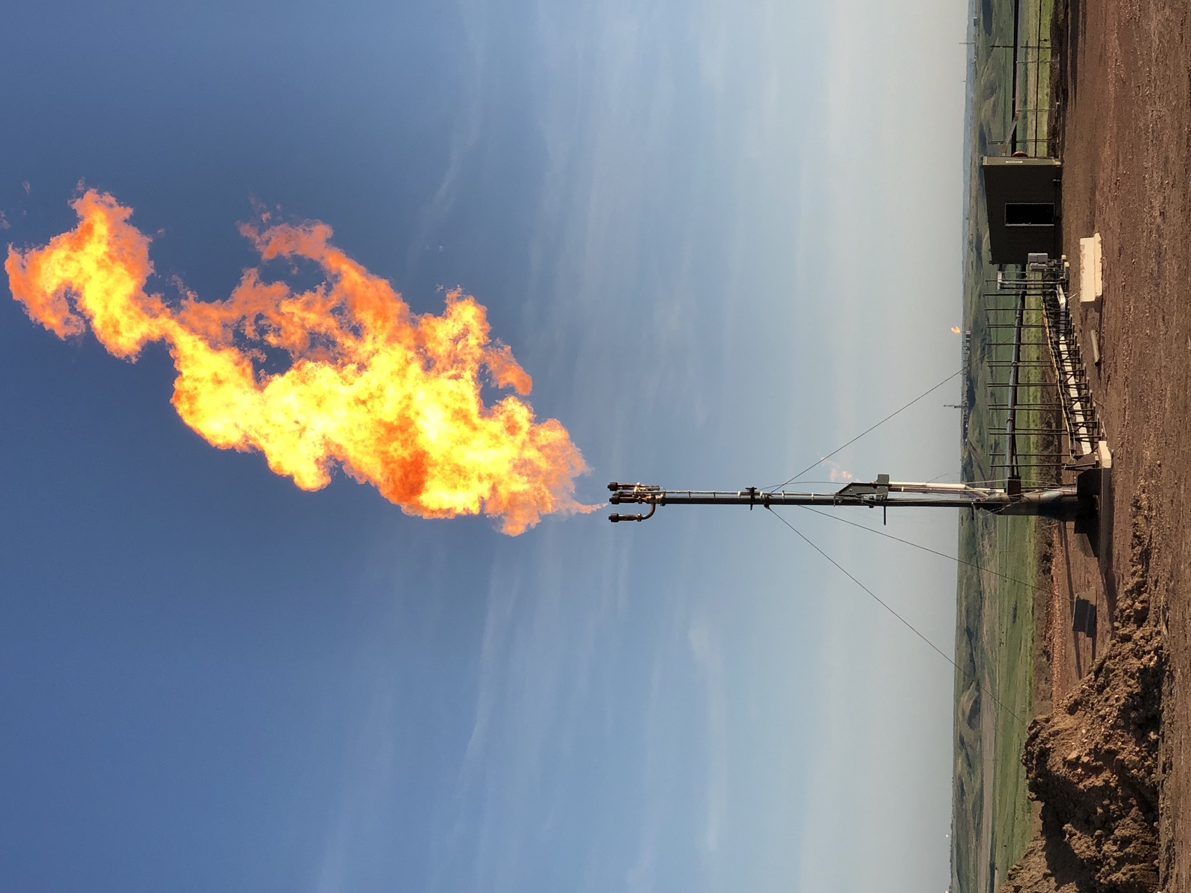 Flare gas burning at an oil site.