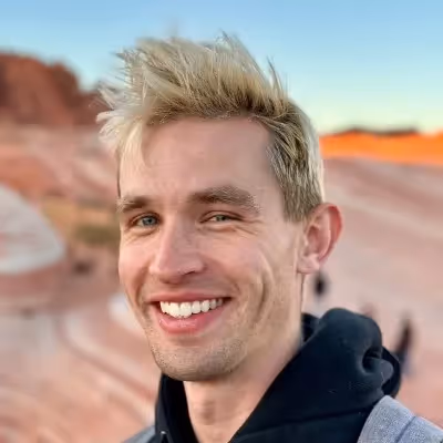 Headshot of Aleks Kamko, AI Researcher at Playground.